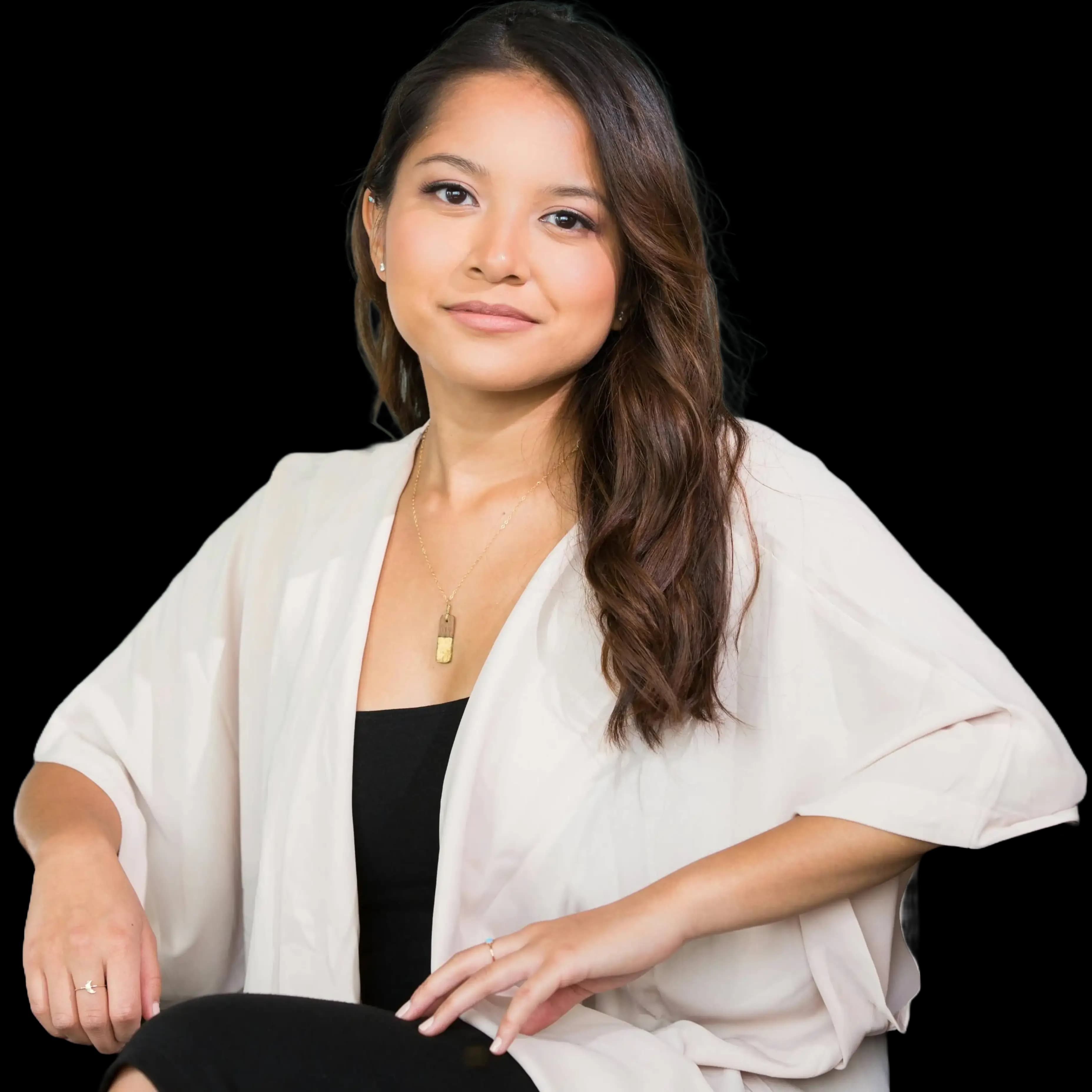 A confident professional woman smiling warmly in a modern office setting, representing expert guidance and support for professional corporation formation.